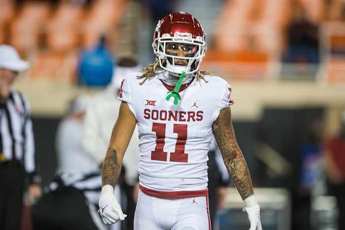Oklahoma Sooners wide receiver Jadon Haselwood (11) warms up before the game against the Oklahoma State Cowboys at Boone Pickens Stadium. Oklahoma State Cowboys won 37-33.